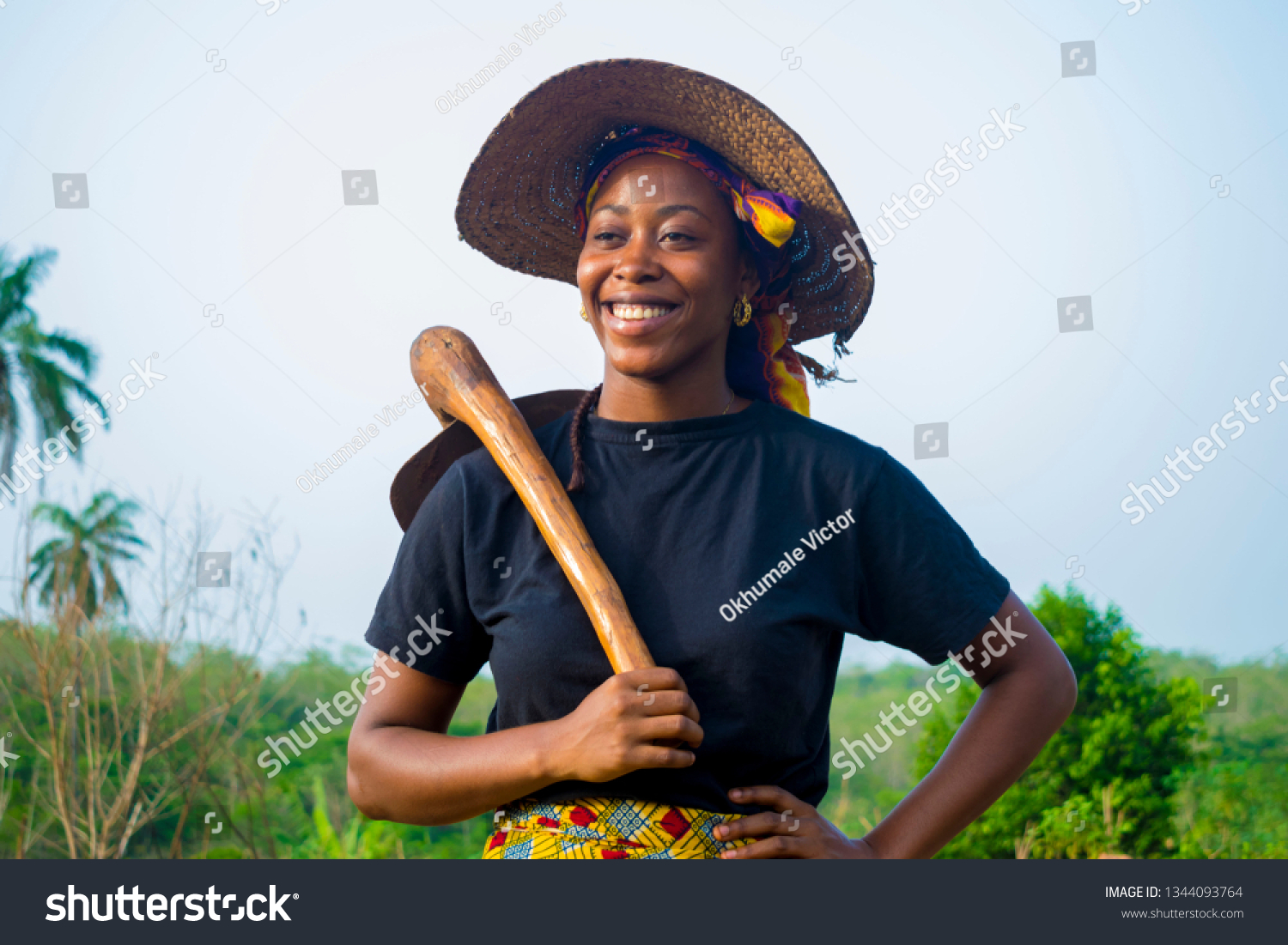 stock-photo-a-young-african-lady-feels-happy-working-on-farm-1344093764